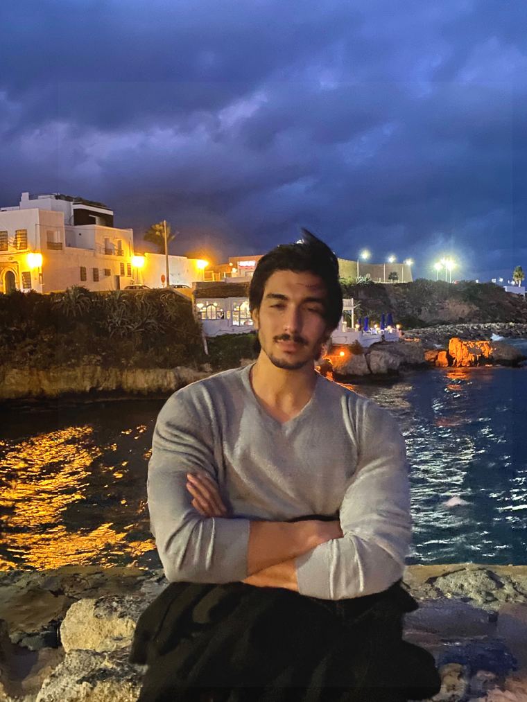 Hazem Telmoudi by the sea at night